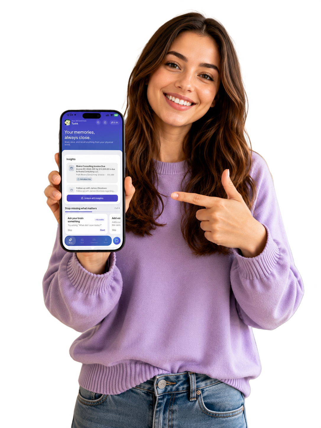 A smiling woman in a purple sweater pointing at a phone showing the Tuskk app